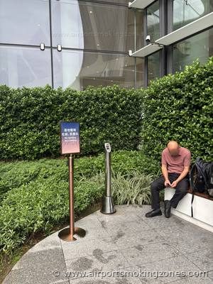 Smoking area at Guangzhou (CAN) airport — Terminal 3, near Gate A838. Outdoor smoking area in the Garden zone (花园). There are benches and…