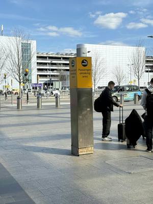 Smoking area at London Heathrow (LHR) airport — Outside International Terminals — Outside terminals, good designated smoking areas.