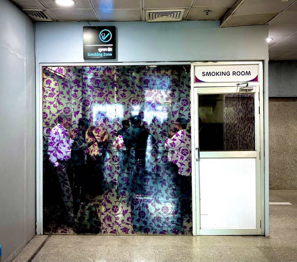 Lucknow Airport Smoking Zone, opposite gate 4 on first floor.