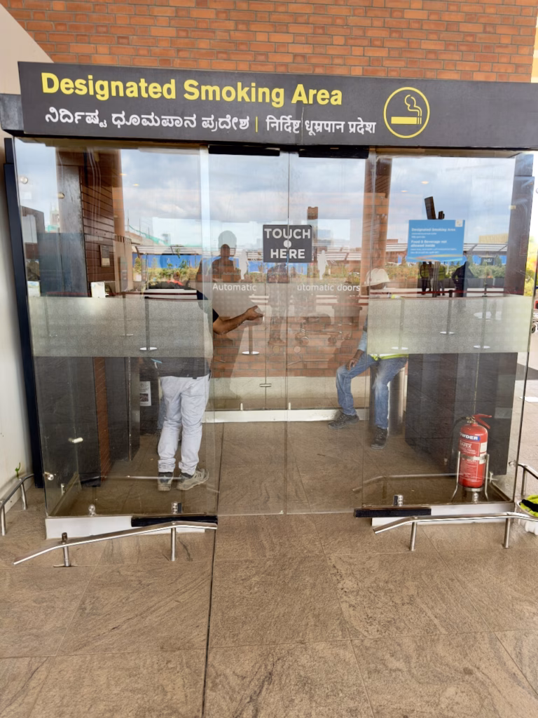 Outside T2 Arrival Blr - Next to Airport Taxi stand towards left from Exit